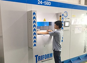 beckwood engineer placing a part on a triform press
